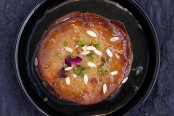 Juicy Sugary Pancakes Sweets Also Called Malpua, Pooa Or Pua Are Traditional Indian Dessert Mithai Drenched, Dunked, Soaked Or Dip In Sugar Syrup Cheeni Ki Chasni. Enjoyed On Holi, Navratri and Diwali