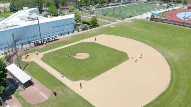 Kids Playing Baseball During Hot Summer Months in Chicago. Aerial Drone View