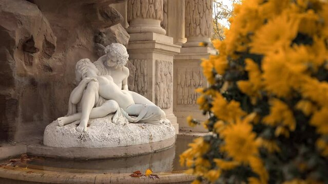"Acis and Galatea" by Auguste Ottin, a sculpture of the Medici Fountain in the Jardin du Luxembourg garden in Paris, France in the Fall