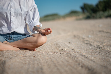 Girl practice meditation on the beach. With space for text or design
