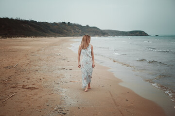 Woman walking on a beautiful beach