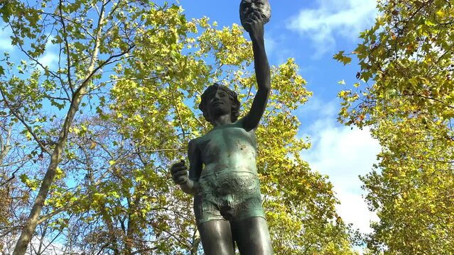 The Mask Seller statue by Zacharie Astruc in the Luxembourg garden in Paris, France