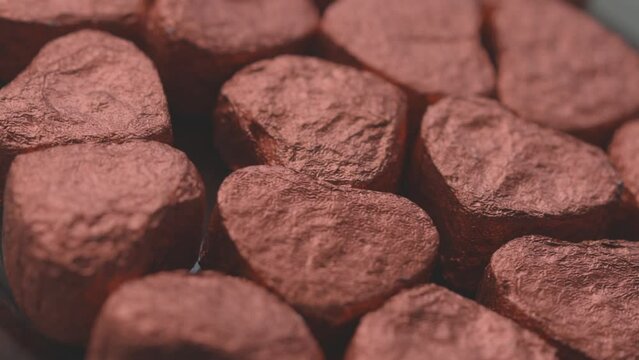heart-shaped pu-erh tea in red foil rotate in a circle