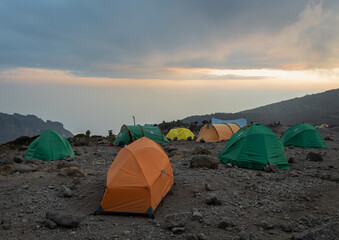 Camping in the Clouds - Tents on a Mountain Peak at Sunset