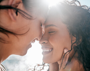 Face, love and nature with a couple together at the beach, sharing an intimate moment outdoor closeup. Trust, travel or relax with a young man and woman enjoying a romantic date bonding in summer