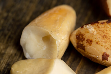 Fresh Brazil nuts peeled from the shell on the table