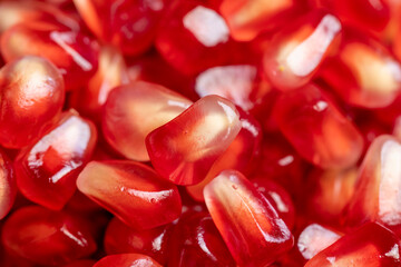 Red ripe pomegranate with red and juicy grains