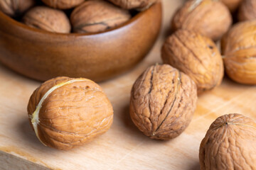 Unpeeled walnut harvest on the table