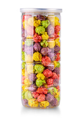 Colorful caramel popcorn in clear jar isolated on white background.