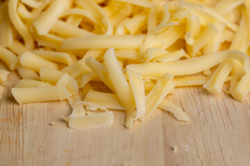 Sliced and grated hard cheese with cashew nuts