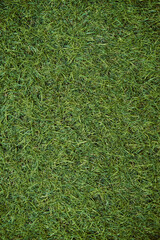 TTop view of artificial green grass texture. Fake Grass used on sports fields for soccer, baseball,...