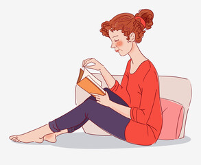 Cute, young woman reading a book 