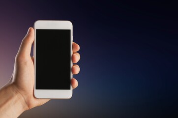 Hand hold modern smartphone with a blank screen