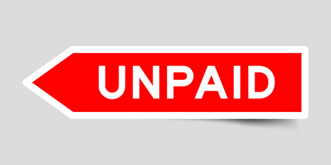 Red color arrow shape sticker label with word unpaid on gray background