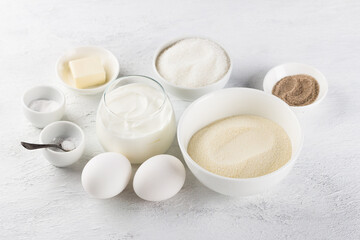 Ingredients for making a delicious semolina pie: semolina, eggs, sour cream or yogurt, sugar,...