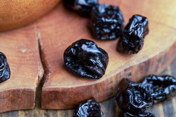 Black pile of prunes from a large number of ripe plums