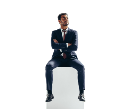 Thoughtful businessman sitting on top of a block on a transparent background