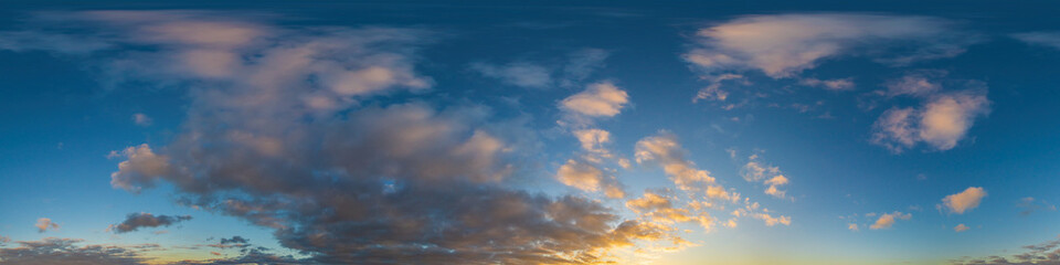 Panorama of a dark blue sunset sky with golden Cumulus clouds. Seamless hdr 360 panorama in spherical equiangular format. Full zenith for 3D visualization, sky replacement for aerial drone panoramas.