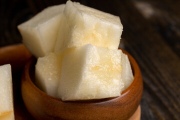 Ripe yellow melon cut into pieces and portions