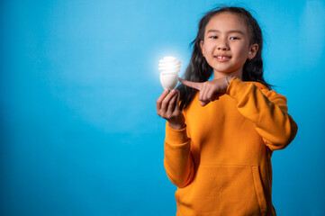 the studio isolated the image of the girl holding the lamp and get the idea with a blue backdrop