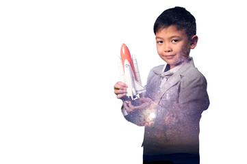 the double exposure image of the boy playing the miniture space rocket and overlay with the milky...