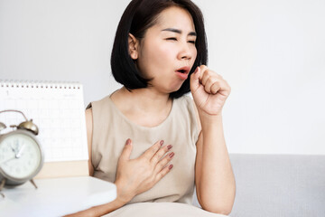 Asian women have problems with chronic cough, woman coughing too long and suffering bronchitis