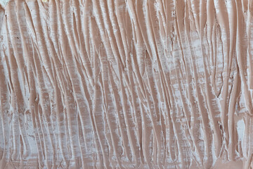 Wall decoration. Abstract peach background. Textured plaster in the form of lines