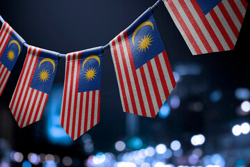 A garland of Malaysia national flags on an abstract blurred background