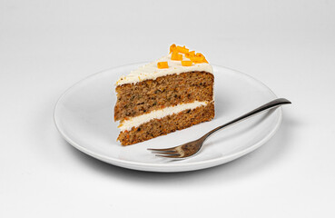 Cake slice on white plate with fork carrot pie apple chocolate crunch cookie vanilla cream 