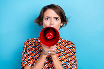 Photo of impressed angry lady dressed print shirt screaming bullhorn isolated blue color background