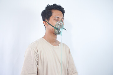 unhealthy young man wearing oxygen mask