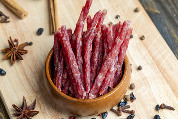 Dried veal sausage during slicing