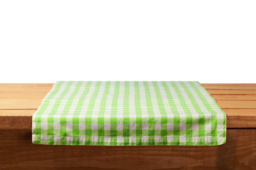 The empty wooden table covered with a color Picnic tablecloth.