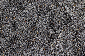 Poppy seeds on the table close up
