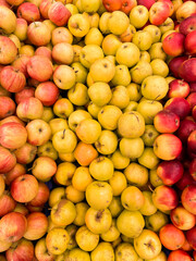lots of yellow red apple vitamins healthy nutrition delicious food as background