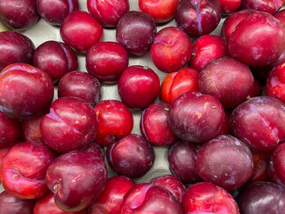 lots of red plum vitamins healthy food delicious food as background