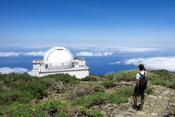 Isaac Newton Telescope and hiker. Roque de los Muchachos, La Palma Island. Spain.