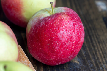 Fresh red and green apples on the kitchen table
