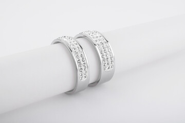 Two Diamonds Wedding Eternity Rings set on white background.