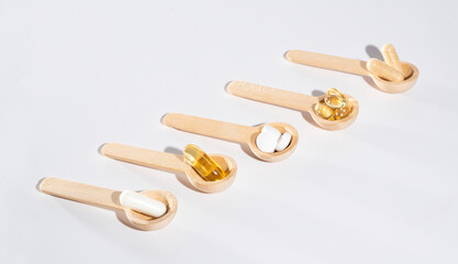 Spoons with vitamins, Vitamin D, omega 3, omega 6, Food supplement oil filled fish oil, vitamin A, vitamin E, flaxseed oil