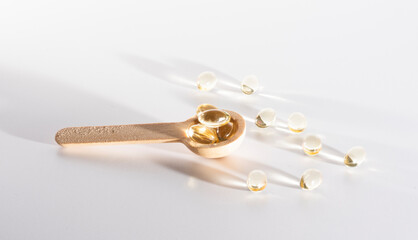 Spoons with vitamins, Vitamin D, omega 3, omega 6, Food supplement oil filled fish oil, vitamin A, vitamin E, flaxseed oil	