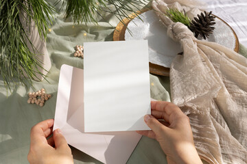 Christmas 5x7 card mockup on girl's hand © PawStudioArt