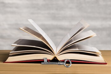 Antique key and open big Bible Book