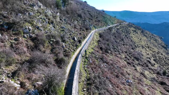 Aerial view from a drone of the landscape around the Juncal channel under Arma&ntilde;&oacute;n and Los Jorrios near the Juncal reservoir and the Las Nieves hermitage. Angostina. Cantabria. Spain. Europe