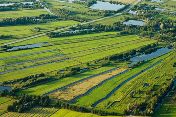 Fototapeta na wymiar Landscape of The Netherlands. Seen from above. Taken from a plane.