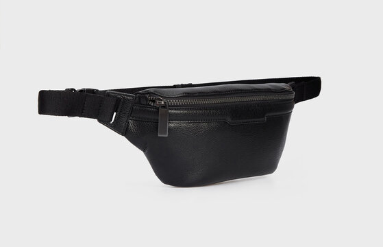 Fashion unisex business Office Waist Belt Bag isolated White Background. Black Leather Banana Bag, waist bag, bumbag with zipper for men. Side view. Template, mock up