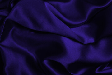 Rich and luxury red silk fabric texture background.