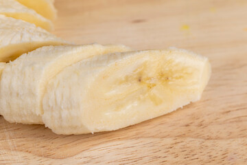 a ripe sweet banana cut into pieces lies on the table