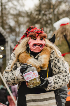 Traditional masks and costumes in Lithuania during Uzgavenes, a Lithuanian folk festival during Carnival, seventh week before Easter, vertical 