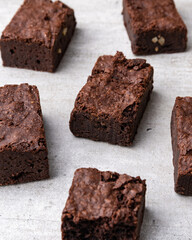 Brownies pieces over white wooden table